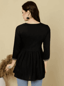 Woman wearing a brown indian kurti for women by Nishtha Chadda