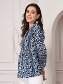 Woman wearing a olive indian kurti for women by Nishtha Chadda