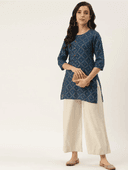 Woman wearing a olive indian kurti for women by Nishtha Chadda