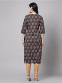 Woman wearing a red indian kurti for women by Nishtha Chadda