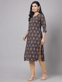 Woman wearing a red indian kurti for women by Nishtha Chadda