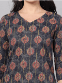 Woman wearing a red indian kurti for women by Nishtha Chadda