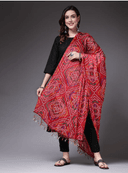Woman wearing a red indian kurti for women by Nishtha Chadda