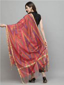 Woman wearing a red indian kurti for women by Nishtha Chadda