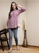 Woman wearing a brown indian kurti for women by Nishtha Chadda