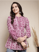 Woman wearing a brown indian kurti for women by Nishtha Chadda