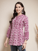 Woman wearing a brown indian kurti for women by Nishtha Chadda