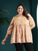 Woman wearing a maroon indian kurti for women by Nishtha Chadda
