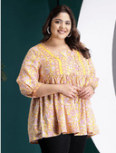 Woman wearing a maroon indian kurti for women by Nishtha Chadda