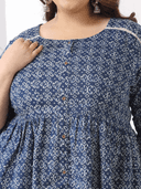 Woman wearing a maroon indian kurti for women by Nishtha Chadda
