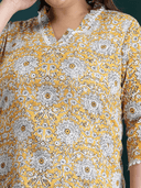 Woman wearing a maroon indian kurti for women by Nishtha Chadda