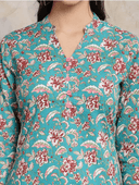 Woman wearing a olive indian kurti for women by Nishtha Chadda