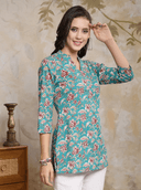 Woman wearing a olive indian kurti for women by Nishtha Chadda