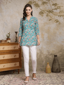 Woman wearing a olive indian kurti for women by Nishtha Chadda