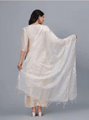 Woman wearing a grey kurti set with dupatta by Nishtha Chadda