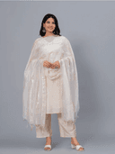Woman wearing a grey kurti set with dupatta by Nishtha Chadda