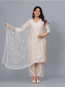 Woman wearing a grey kurti set with dupatta by Nishtha Chadda
