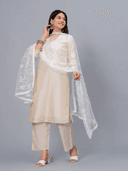 Woman wearing a grey kurti set with dupatta by Nishtha Chadda