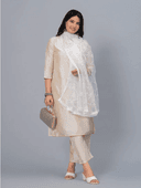 Woman wearing a grey kurti set with dupatta by Nishtha Chadda