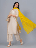 Woman wearing a grey kurti set with dupatta by Nishtha Chadda