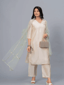 Woman wearing a beige cotton tunic for women by Nishtha Chadda