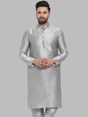 Model wearing a grey party wear kurta by Nishtha Chadda