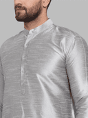 Model wearing a grey party wear kurta by Nishtha Chadda