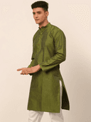 Model wearing a olive party wear kurta by Nishtha Chadda
