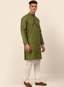 Model wearing a olive party wear kurta by Nishtha Chadda