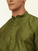 Model wearing a olive party wear kurta by Nishtha Chadda