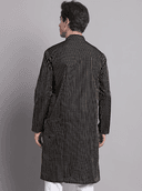 Model wearing a grey party wear kurta by Nishtha Chadda