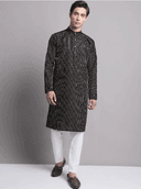 Model wearing a grey party wear kurta by Nishtha Chadda