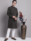 Model wearing a grey party wear kurta by Nishtha Chadda