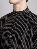 Model wearing a grey party wear kurta by Nishtha Chadda