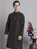 Model wearing a grey party wear kurta by Nishtha Chadda