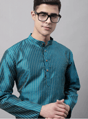 Model wearing a teal party wear kurta by Nishtha Chadda