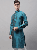 Model wearing a teal party wear kurta by Nishtha Chadda