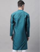 Model wearing a teal party wear kurta by Nishtha Chadda