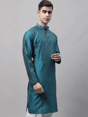 Model wearing a teal party wear kurta by Nishtha Chadda
