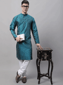 Model wearing a teal party wear kurta by Nishtha Chadda
