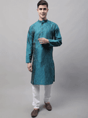 Model wearing a teal party wear kurta by Nishtha Chadda