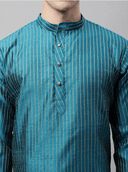 Model wearing a teal party wear kurta by Nishtha Chadda