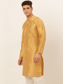 Model wearing a mustard party wear kurta by Nishtha Chadda
