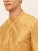 Model wearing a mustard party wear kurta by Nishtha Chadda
