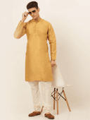 Model wearing a mustard party wear kurta by Nishtha Chadda