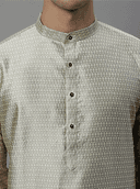 Model wearing a olive party wear kurta by Nishtha Chadda