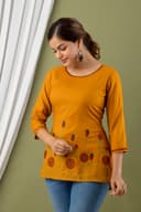 Woman wearing a brown indian kurti for women by Nishtha Chadda
