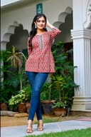 Woman wearing a black kurti set with dupatta by Nishtha Chadda