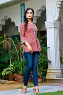 Woman wearing a black kurti set with dupatta by Nishtha Chadda
