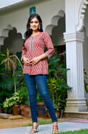 Woman wearing a black kurti set with dupatta by Nishtha Chadda